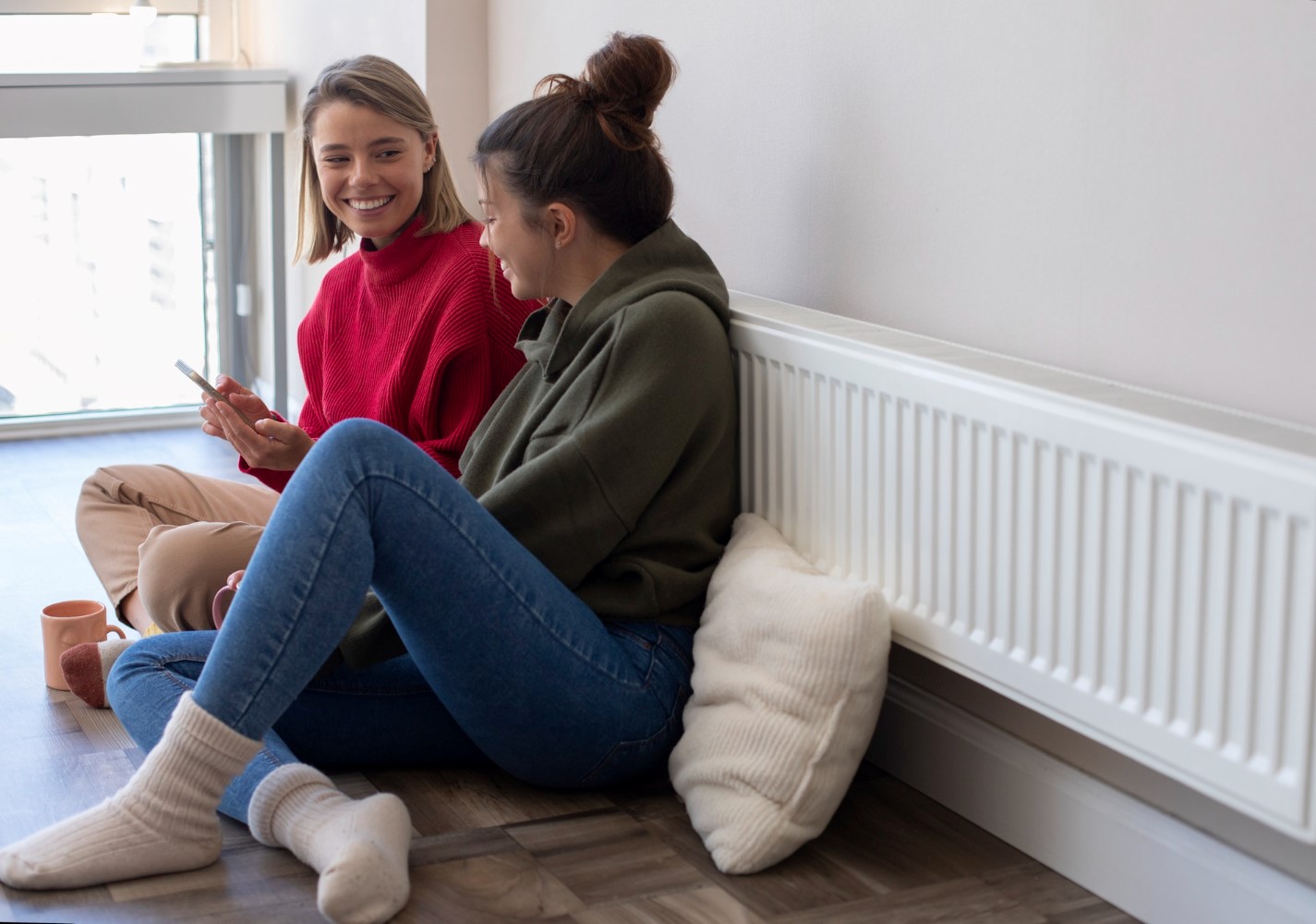 Women looking happy after installing radiators in home